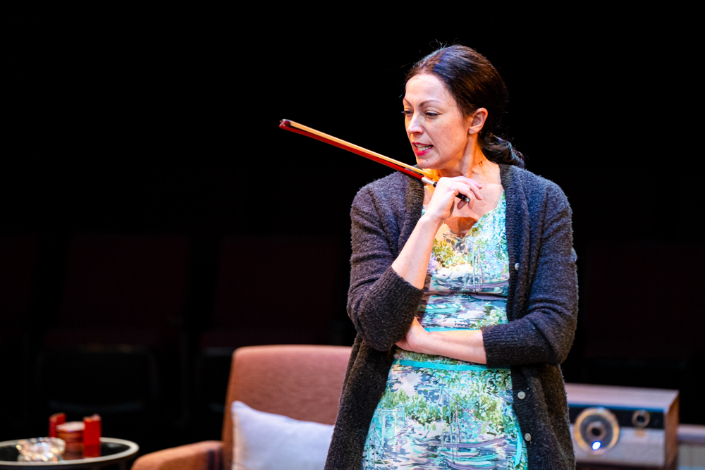 actress holding a stick prop at the Irish Classical Theatre Company